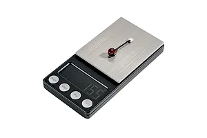 A single BetaFPV brushless motor sitting on a digital scale showing a weight measurement.