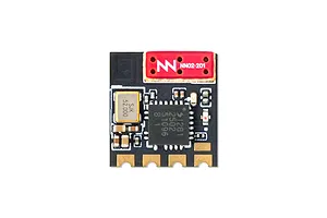 Top-down view of a BetaFPV 2.4GHz ELRS Lite receiver circuit board featuring a flat ceramic antenna and various electronic components on a black PCB.