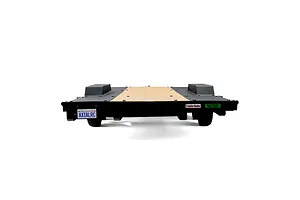 Rear view of an Axial 1/10 scale flat bed vehicle trailer with a wooden-look deck, black diamond plate fenders, and a custom California license plate.
