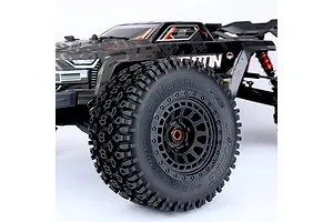 Close-up of a Method RC 3.8 Geoform belted tyre mounted on a black Array wheel, attached to an RC truck.