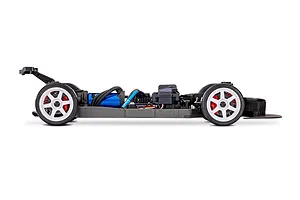 Side profile view of a Traxxas 4-Tec 2.0 RC car chassis showing the blue electric motor, white wheels, and black frame against a white background.