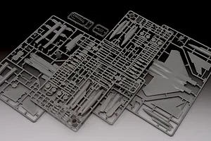 Grey plastic model kit sprues for a 1/72 scale Boeing F-15C Eagle fighter jet, showing various aircraft parts and clear canopy pieces.