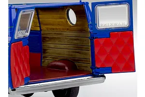 Rear view of a Revell 1/25 scale Stranger Things model van with open rear doors showing wood-paneled interior and red quilted door panels.