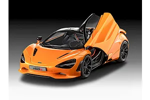 A studio shot of a 1/24 scale Revell McLaren 750S plastic model car in bright orange with dihedral doors open.