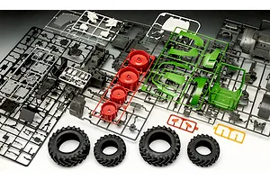 Plastic model kit sprues and rubber tires for a Revell Fendt 728 Vario tractor model, laid out on a surface.