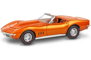 A completed 1/25 scale model of a metallic orange 1968 Chevrolet Corvette L-88 roadster with red-line tires.