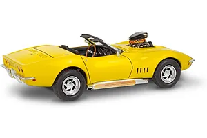 A yellow 1/25 scale model of a 1968 Corvette L-88 roadster with a prominent blower engine protruding from the hood.