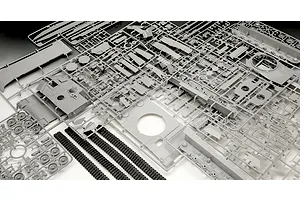 Grey plastic model kit sprues and black rubber tank tracks for a 1/35 scale Leopard 2A7A1 tank model.