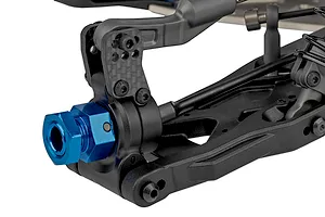 Close-up of the rear suspension assembly of a Team Associated RC8T4.2e RC truggy, featuring a blue anodized wheel hex and carbon fiber shock tower mount.