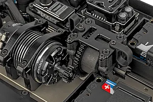 Close-up of the electric motor and center differential assembly inside a Team Associated RC8T4.2e RC truggy chassis.