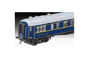 A side view of a detailed blue and white Orient Express restaurant carriage model kit against a black background.