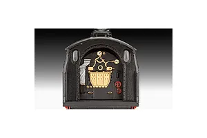 Close-up of the detailed cab interior of a Revell 1/87 scale model steam locomotive, showing gauges, valves, and controls.