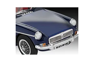 Close-up of a dark blue MGB Roadster model car showing the front hood, grille, chrome bumper, and wire-spoke wheel.