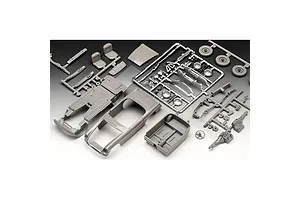 Unassembled plastic model car kit parts for a Revell 1/32 MGB Roadster, including grey sprues, a car body, interior tub, and chrome-plated parts.