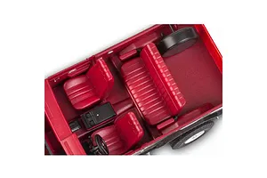 Top-down view of the red interior of a 1/25 scale model GMC Jimmy, showing seats, steering wheel, and center console.