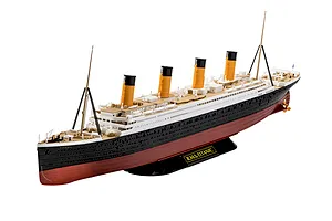 A fully assembled 1/600 scale plastic model of the R.M.S. Titanic, featuring black, white, and red hull details with yellow funnels, mounted on a black display stand.