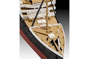 Close-up of the bow section of a Revell 1/600 scale RMS Titanic plastic model kit, showing the deck, mast, and hull details.
