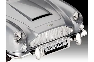 Close-up of the front hood, grille, and bumper of a silver Aston Martin DB5 model car.