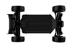 Top-down view of the UDI RC Gleam Mid RC buggy chassis showing the black plastic tub, suspension arms, and off-road tires.