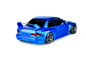 Rear three-quarter view of a blue MST RMX 4.0 RC drift car with a Subaru-style body shell on a white background.