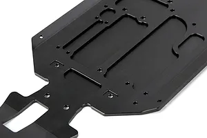 A black anodized aluminium RC main chassis plate with various mounting holes and cutouts, viewed from an angle against a white background.