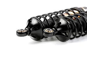 Two Rovan aluminium front adjustable RC shock absorbers in bronze and black finish, shown against a white background.