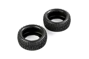 Two black rubber RC short course truck tyres with a blocky tread pattern, shown from an angled perspective against a white background.