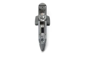Top-down view of a grey foam RC airplane fuselage showing the internal cockpit and battery compartment area.