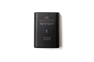 Top-down view of a black Spektrum S20 Smart LiPo charger unit on a white background.