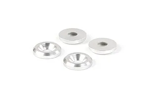 Four silver-coloured metal countersunk washers arranged on a white background.