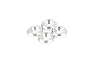 Four silver-coloured metal countersunk washers arranged in a cluster on a white background.