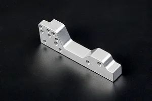 A silver Rovan aluminium engine mount for RC vehicles, shown from an angled perspective against a dark background.