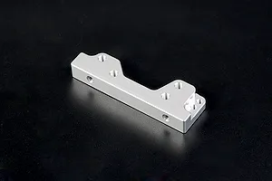A silver Rovan aluminium engine mount for RC vehicles, featuring multiple pre-drilled screw holes, isolated against a dark background.