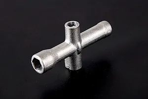 A silver-coloured metal cross wrench tool for RC vehicles, shown against a plain black background.