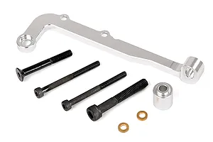A silver aluminium RC car clutch carrier and brake mount component with four black screws, a small silver spacer, and two small brass washers.
