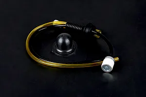 Rovan Baja fuel system kit including a fuel filter, black and yellow fuel tubing, a rubber grommet, and a black tank breather cap seal.