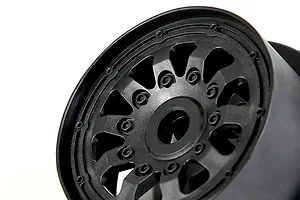 Close-up of a black Rovan RC wheel rim with a multi-spoke design against a white background.