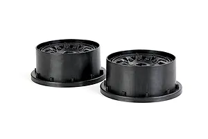 Two black plastic RC car wheel hubs or rims shown from a side-angle perspective against a white background.