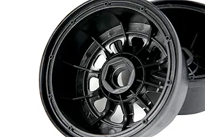 A black plastic RC car wheel hub with a hexagonal center mount, shown from an angled perspective against a white background.
