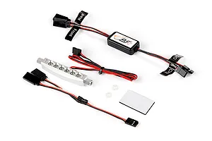 Rovan RC light controller kit with a silver LED light bar, wiring harnesses, and adhesive mounting pad on a white background.