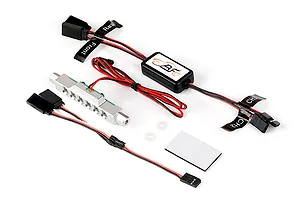 Rovan RC light controller kit featuring a silver LED light bar, control module, wiring harnesses with labels, and mounting hardware on a white background.
