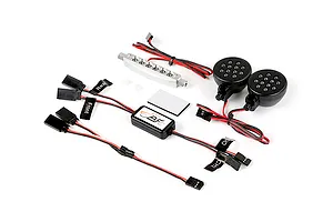 Rovan RC light controller kit including a silver LED bar, two round LED light pods, a control module, and various wiring harnesses with labels.