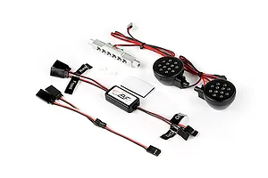 Rovan RC light controller kit including a silver LED bar, two round black LED light pods, a control module, and wiring harnesses.