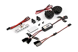 Rovan RC light controller kit including a silver LED light bar, two round black LED light pods, a control module, mounting brackets, and wiring harnesses.
