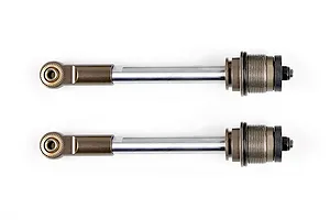 Two Rovan RC shock absorber shafts with silver metal rods and brown anodized ends, laid horizontally against a white background.