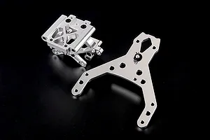 Rovan silver aluminium front bulkhead set including an upper plate for RC vehicles, shown on a plain black background.