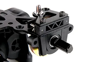 Close-up of a Rovan 1/5 scale RC Baja transmission assembly featuring a black plastic gearbox, metal brake components, and a drive shaft.