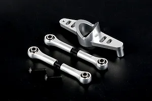 Rovan silver aluminium steering assembly parts including a central mount, two turnbuckle rods with ball ends, and two black screws on a black background.