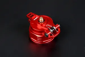 A red anodized aluminium fuel tank cap for RC vehicles, featuring a spring-loaded latch mechanism and a brass-coloured center fitting.