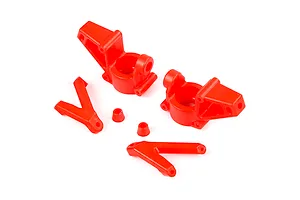 A set of red nylon RC steering hubs and associated suspension components on a white background.